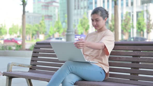 Indian Woman Leaving Office After Closing Laptop