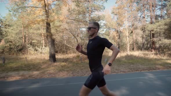 Runner Man Fit Athlete Legs Jogging.Triathlete Running,Sprinting And Endurance Marathon Workout