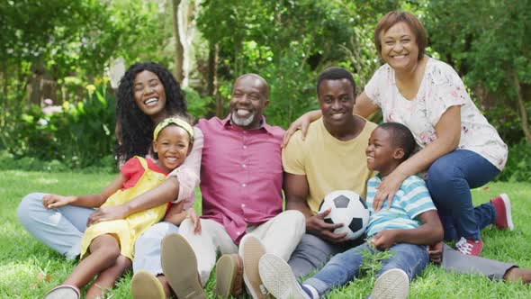 Animation of happy african american family having fun together in garden