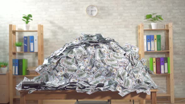 Big Pile of Bills Banknotes on the Office Desk No Body