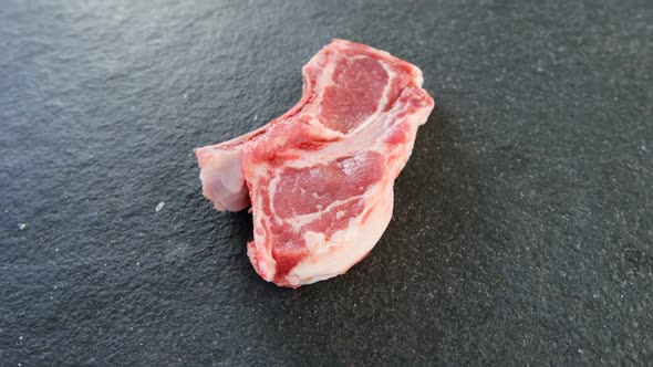 Sirloin chop on concrete background