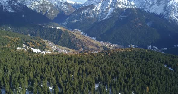 Aerial drone view of snow covered mountains in the winter.