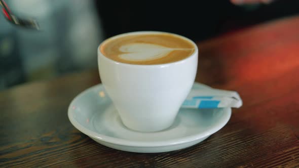 Serve a cup of coffee. Latte art coffee