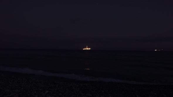 large offshore oil rig at night