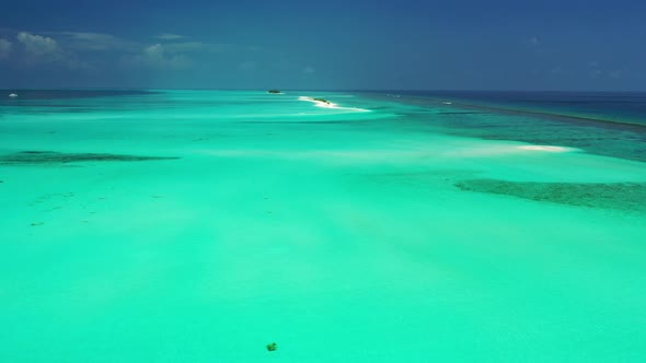 Natural drone island view of a sandy white paradise beach and aqua blue ocean background in hi res 4