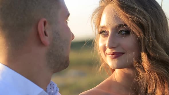 Beautiful Wedding Couple Kiss on the Sunset in the Mountains