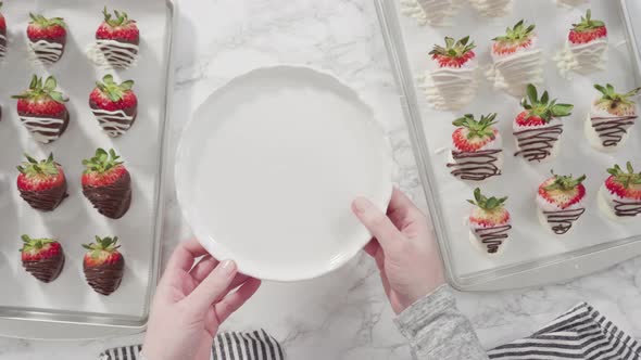 Flat lay. Step by step. Arranging chocolate strawberries on the cake stand.