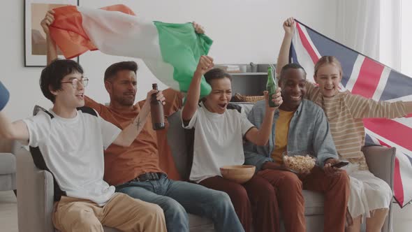 Fans with Flags Watching Sports on TV