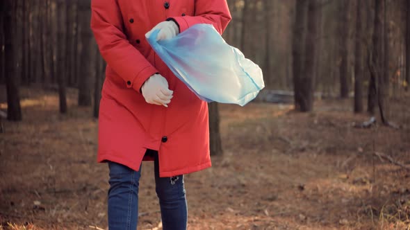 Cleaner Woman Collecting Trash In Forest. Trash Volunteer Eco Activist. Picking Tidying Trash.