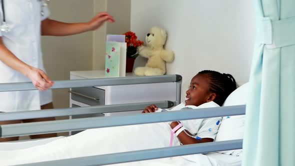 Female doctor examining a sick girl