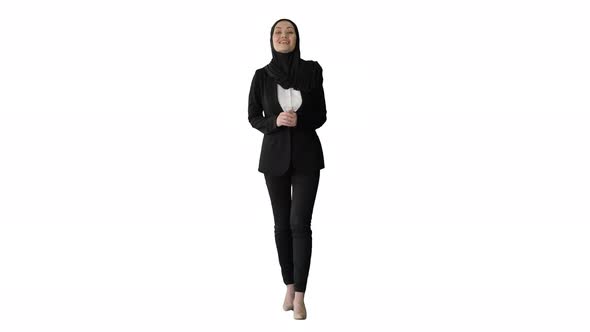 Smiling Arab Woman Wearing Hijab Talking About Business While Walking and Gesturing on White