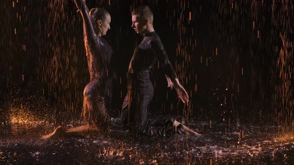 Dynamic and Passionate Jive Dance Performed By Professionals. Couple Dancing Under the Drops of Rain