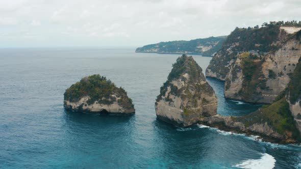 Aerial shot of beautiful rocks on the sea. Nusa Penida Island.