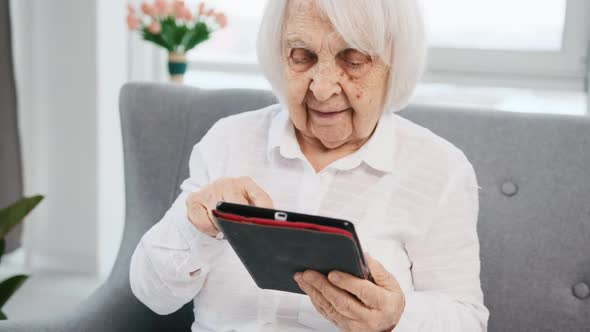 Elderly Woman with Tablet