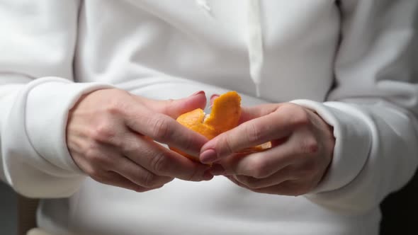 Girl with Tangerine in Hands