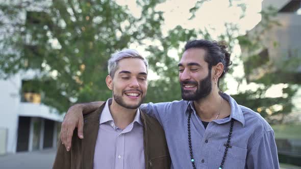 Young Happy Male Gay Couple Embracing Each Other Smiling and Enjoying Time Together