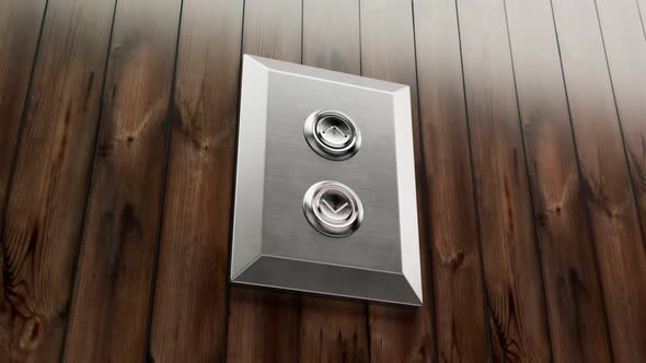 Chrome elevator up-down buttons on a vintage wooden wall in the office. 4KHD