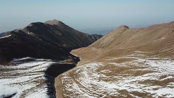 Autumn Mountains Covered with Snow in Places