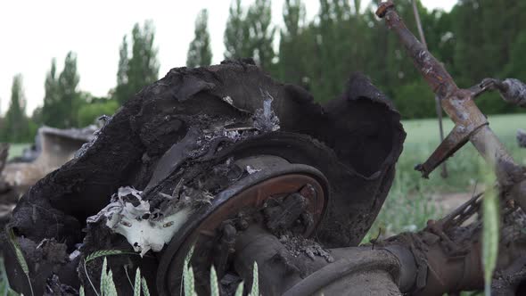 Downed military transport aircraft in a wheat field. Russian aggression in Ukraine.