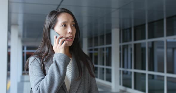 Woman talk to cellphone at outdoor