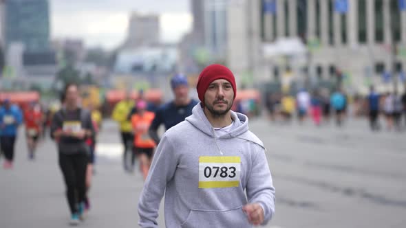 Major Running Competition with Crowds Groups of Athletic Runners and Sportsmen