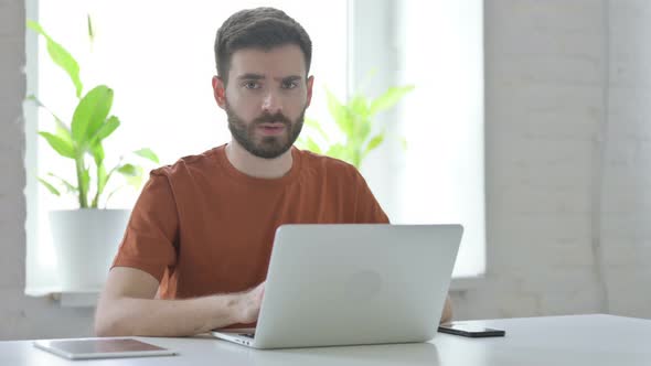 Rejecting Gesture By Young Man at Work