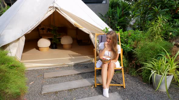 Tourist Woman Eating Smoothie Bowl Near Glamping Glamorous Camping Modern House