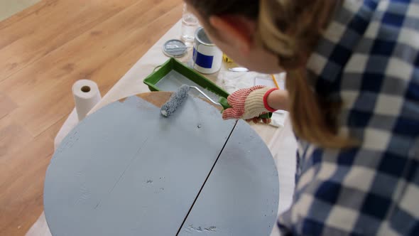 Woman Painting Old Wooden Table with Grey Color
