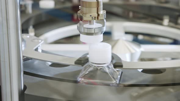 Automated pharmaceutical manufacturing line, bottles filled with liquid