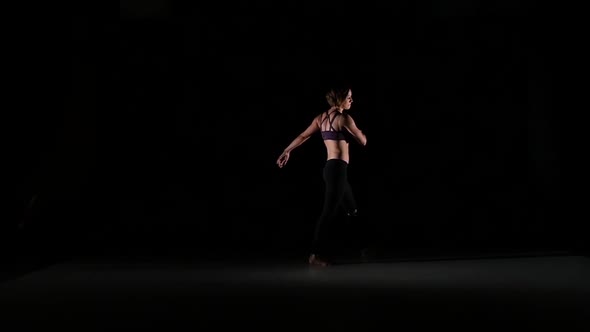 Girl Dancing Beautiful Contemp in the Shadow on Black Background, Slow Motion