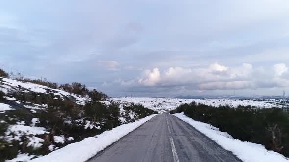 Driving Car in Winter Landscape