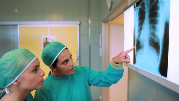 Medical team looking at a Xray