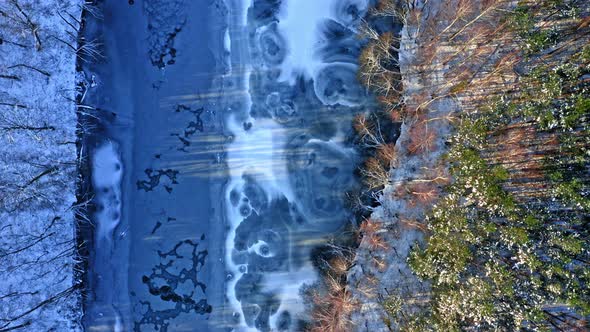 Winter river and forest. Aerial view of winter nature