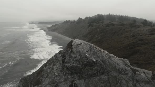 Aerial footage of Sharp Point rock in front of the ocean at Dry Lagoon State Park, California, USA