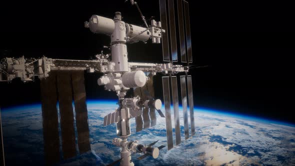 International Space Station in Outer Space Over the Planet Earth alt