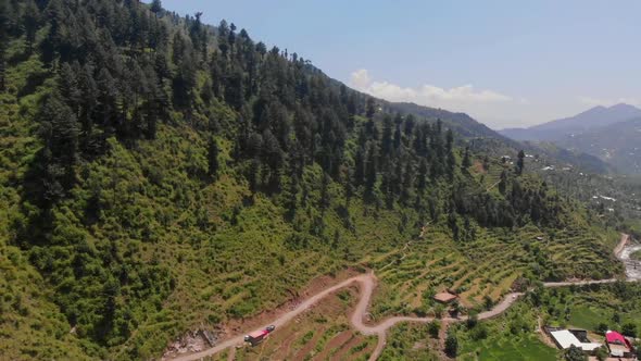 Aerial View Of Winding Road Through Valley Near Gabin Jabba In Pakistan. Tracking Shot
