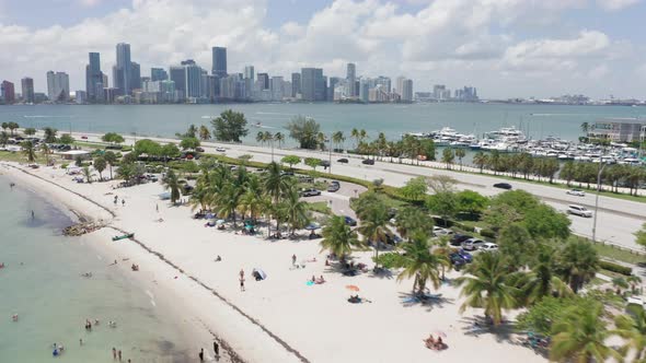  Aerial View on Highway Along Beautiful Beach and Miami Downtown on Background alt