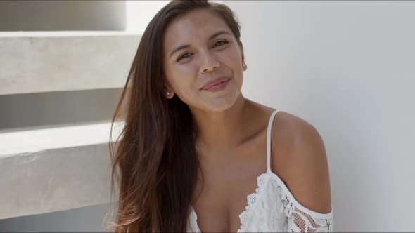 Happy Beautiful Woman Sitting on Stairs