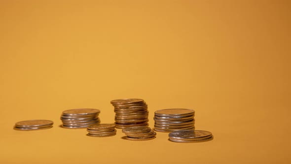 Rows of Money Coins on Gold Background