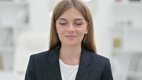 Portrait of Appreciative Businesswoman Saying Yes By Shaking Head