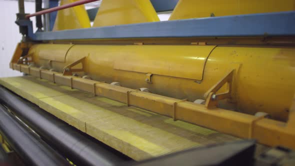 Finished Slabs of Rockwool Moving on Conveyor Belt out of Machine