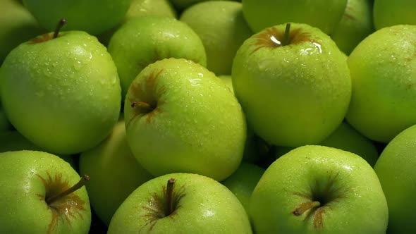 Spraying Green Apples Pile Closeup