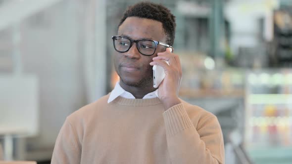 Creative African Man Talking on Phone