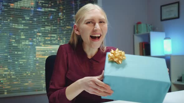 Excited Young Woman Announcing the Winner and Presenting the Prize Live