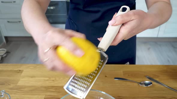 He Rubs Lemon Peel Into a Bowl