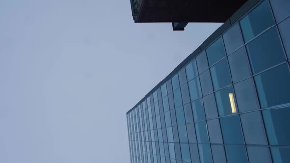 Worms Eye Pan of Brick and Glass Buildings From Streetview