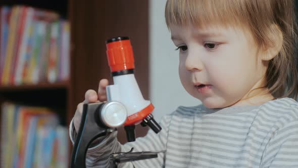 Child and a Microscope