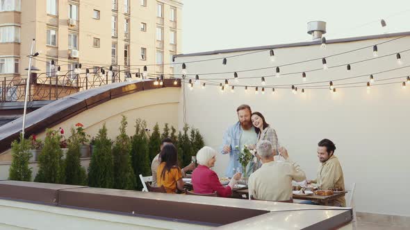 Family and friends having dinner together