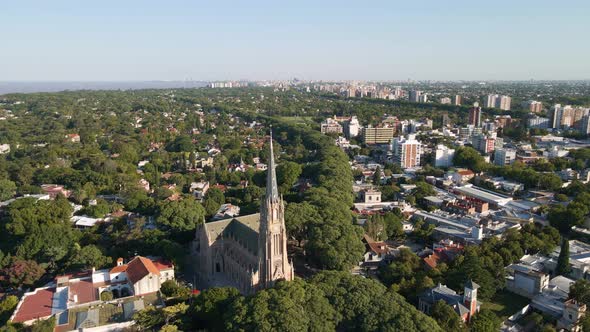 Aerial descending towards San Isidro Cathedral and Buenos Aires city on background