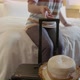 asian female casual cloth pulling wheeled bag is departing from hotel room - VideoHive Item for Sale